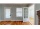 Light-filled living room features hardwood floors, built-in shelving, and a fireplace at 2418 2Nd S Ave, St Petersburg, FL 33712