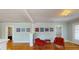 Living room with hardwood floors and red armchairs at 2418 2Nd S Ave, St Petersburg, FL 33712