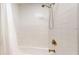 Large shower with white tile and a handheld shower head at 2418 2Nd S Ave, St Petersburg, FL 33712