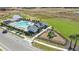 Aerial view of community pool, playground, and parking at 28965 Orange Berry Dr, Wesley Chapel, FL 33543