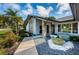 Inviting entryway with a water feature and walkway at 2973 Somersworth Dr, Clearwater, FL 33761