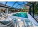 Enjoy this refreshing screened pool and lounge chairs at 2973 Somersworth Dr, Clearwater, FL 33761