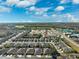 Wide aerial view of houses and development at 31806 Larkenheath Dr, Wesley Chapel, FL 33543