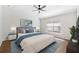 This main bedroom features a ceiling fan, recessed lighting, and a large window for plenty of natural light at 31806 Larkenheath Dr, Wesley Chapel, FL 33543