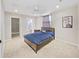 Bright bedroom with ceiling fan and en-suite bathroom at 3405 W Swann Ave # 6, Tampa, FL 33609