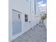 Building exterior with gray door and gravel pathway at 3405 W Swann Ave # 6, Tampa, FL 33609