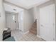 Hallway with access to rooms, stairs, and tiled floors at 3405 W Swann Ave # 6, Tampa, FL 33609