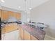 Modern kitchen with granite countertops and stainless steel appliances at 3405 W Swann Ave # 6, Tampa, FL 33609