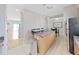 Modern kitchen with breakfast bar and granite countertops at 3405 W Swann Ave # 6, Tampa, FL 33609