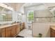 Elegant bathroom featuring a large walk-in shower at 3710 Rain Tree Ct, Palm Harbor, FL 34685