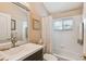 Bathroom with a bright vanity, neutral colors, and a tub-shower combo at 3710 Rain Tree Ct, Palm Harbor, FL 34685