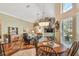 Inviting living room featuring hardwood floors, comfortable seating, and custom built-in shelving at 3710 Rain Tree Ct, Palm Harbor, FL 34685