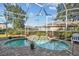 Enclosed pool and patio area with seating and dining furniture at 3710 Rain Tree Ct, Palm Harbor, FL 34685