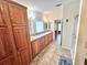 Bathroom with and sinks, wooden cabinets and tile flooring at 37544 Corey Lewis Ave, Zephyrhills, FL 33541