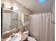 Bathroom featuring a vanity, mirror, a shower, and a toilet at 37544 Corey Lewis Ave, Zephyrhills, FL 33541