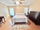 Comfortable bedroom with wood floors and lots of natural light at 37544 Corey Lewis Ave, Zephyrhills, FL 33541