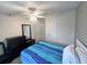 Bedroom featuring a bed, a dresser, carpet flooring, and ceiling fan at 37544 Corey Lewis Ave, Zephyrhills, FL 33541