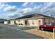 Community clubhouse with solar panels and parking at 37544 Corey Lewis Ave, Zephyrhills, FL 33541