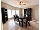 The dining room has tile flooring, a ceiling fan, and a large window with great natural lighting at 37544 Corey Lewis Ave, Zephyrhills, FL 33541
