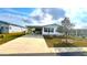 Inviting single-story home with a well-maintained lawn and ample parking space at 37544 Corey Lewis Ave, Zephyrhills, FL 33541