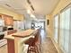 Spacious kitchen area with tile flooring, pendant lights, and a breakfast bar for casual dining at 37544 Corey Lewis Ave, Zephyrhills, FL 33541