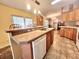 The well-appointed kitchen boasts a breakfast bar and plenty of space at 37544 Corey Lewis Ave, Zephyrhills, FL 33541