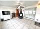 Sunroom with tile floors, seating and storage at 37544 Corey Lewis Ave, Zephyrhills, FL 33541