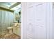 Bathroom with shower/tub combo, toilet and a linen closet at 38351 Ironwood Pl, Zephyrhills, FL 33542