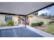 Covered carport with access to the front door of the home at 38351 Ironwood Pl, Zephyrhills, FL 33542