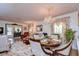 Elegant dining room with a chandelier and a round wooden table at 38351 Ironwood Pl, Zephyrhills, FL 33542