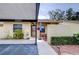 Home entrance with covered patio, seating, and decor at 38351 Ironwood Pl, Zephyrhills, FL 33542