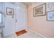 Light and airy entryway with a welcoming doormat at 38351 Ironwood Pl, Zephyrhills, FL 33542