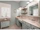 Double vanity bathroom with light-colored cabinets and a tranquil atmosphere at 404 Manns Harbor Dr, Apollo Beach, FL 33572