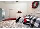 Main bedroom with black and white bedding and red accents at 404 Manns Harbor Dr, Apollo Beach, FL 33572