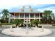 Elegant community clubhouse with fountain and palm trees at 404 Manns Harbor Dr, Apollo Beach, FL 33572