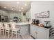 Modern kitchen with light-grey cabinets and a coffee bar, stylish and functional at 404 Manns Harbor Dr, Apollo Beach, FL 33572