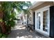 Small, private patio with table and chairs, adjacent to home at 404 Manns Harbor Dr, Apollo Beach, FL 33572