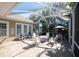 Spacious screened porch with seating and table at 404 Manns Harbor Dr, Apollo Beach, FL 33572