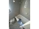 Bathroom with a bathtub and tiled walls at 404 N Oakwood Ave, Brandon, FL 33510