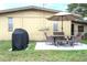 Backyard patio with table, chairs and grill at 4513 W Clifton St, Tampa, FL 33614