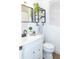 Bright bathroom features white vanity, toilet and floating shelves at 4513 W Clifton St, Tampa, FL 33614