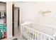 Bedroom with crib and closet at 4513 W Clifton St, Tampa, FL 33614