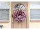 Brown front door adorned with a purple wreath at 4513 W Clifton St, Tampa, FL 33614