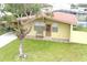 House front with a bench and a wreath on the door at 4513 W Clifton St, Tampa, FL 33614