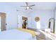 Bright bedroom with wood floors and access to other rooms at 4804 Foxshire Cir, Tampa, FL 33624