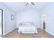 Light and airy bedroom featuring wood floors and access to a bathroom at 4804 Foxshire Cir, Tampa, FL 33624