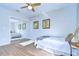 Bright bedroom with mirrored closet and wood floors at 4804 Foxshire Cir, Tampa, FL 33624