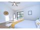 Spacious bedroom with wood floors and sliding glass doors to a patio at 4804 Foxshire Cir, Tampa, FL 33624