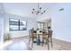 Charming dining room with hardwood floors and a round wooden table at 4804 Foxshire Cir, Tampa, FL 33624