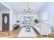 Living room with bay window and modern chandelier at 4804 Foxshire Cir, Tampa, FL 33624